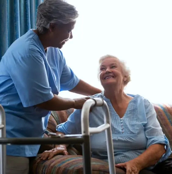 caregiver and senior patient smiling