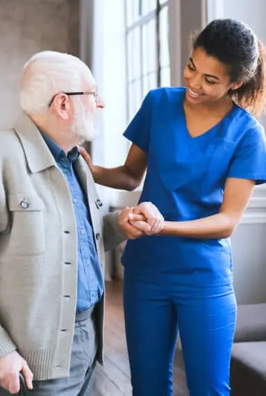 caregiver and senior patient smiling